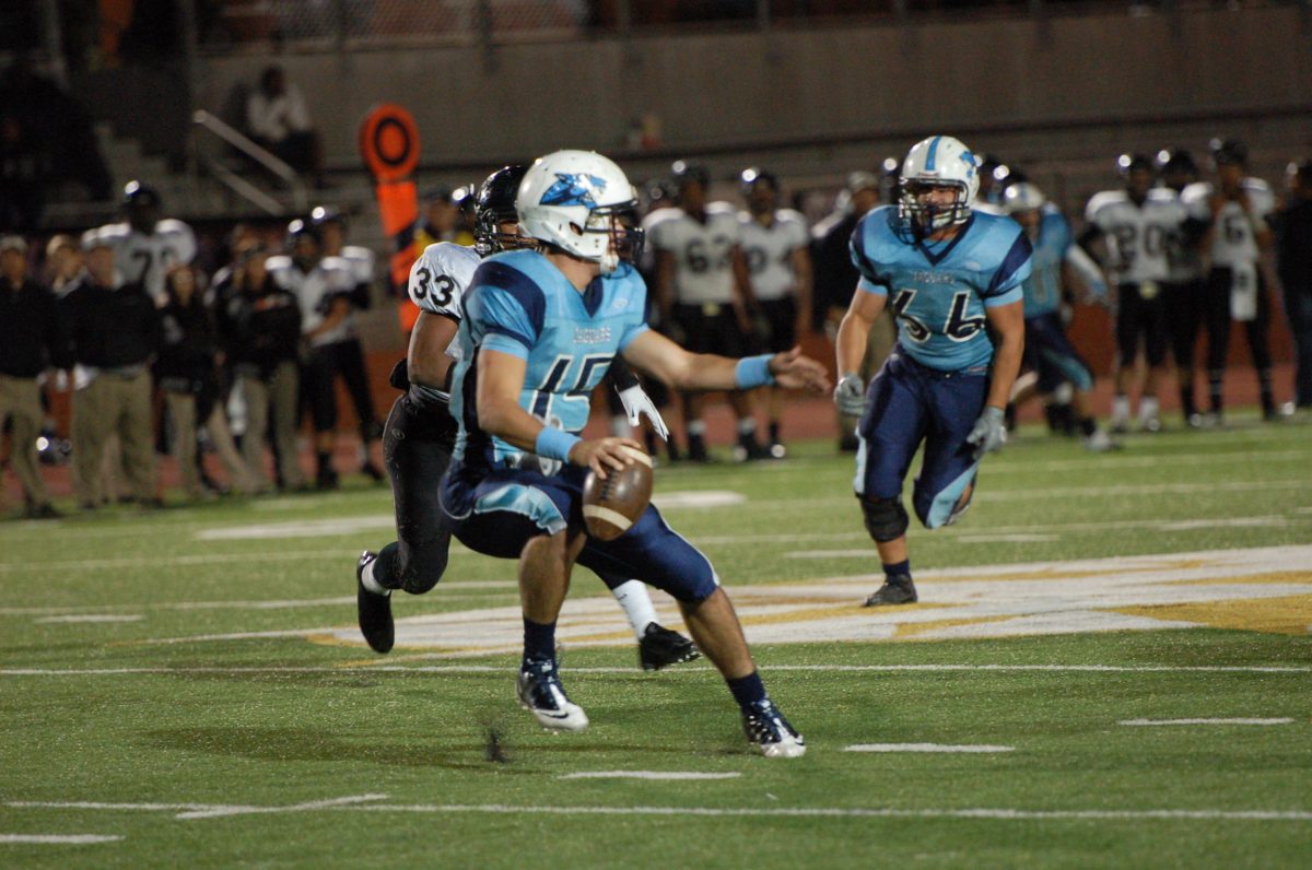 Quarterback Cohner Mokry darts out of the way of an approaching Knight defender