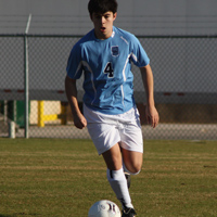 One of our many skilled boys, varsity soccer players leads the team to victory.