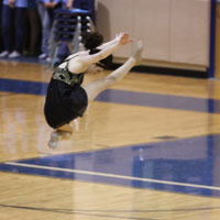 Senior Caitlin Hill showcases her talent as she leaps in the air, in her lyrical solo dance at the 2012 Show-Offs.