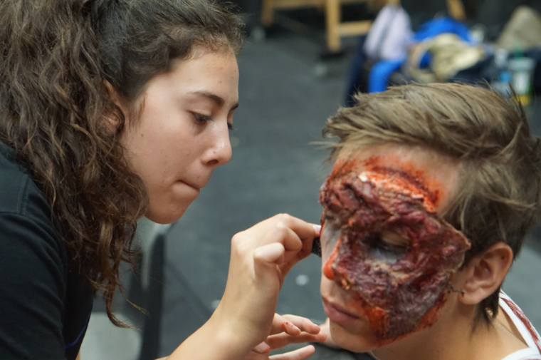 Student+applies+bloody+makeup+to+create+a+realistic+looking+monster.