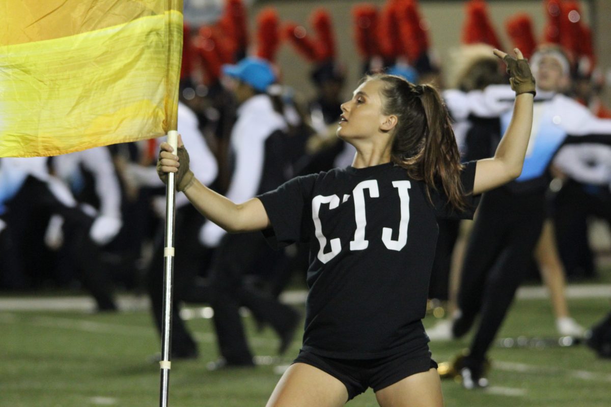 Maddie+Chondra+dances+while+performing+for+color+guard+during+the+halftime+performance+against+Brandeis.+Photo+by+Adelin+Blackmon