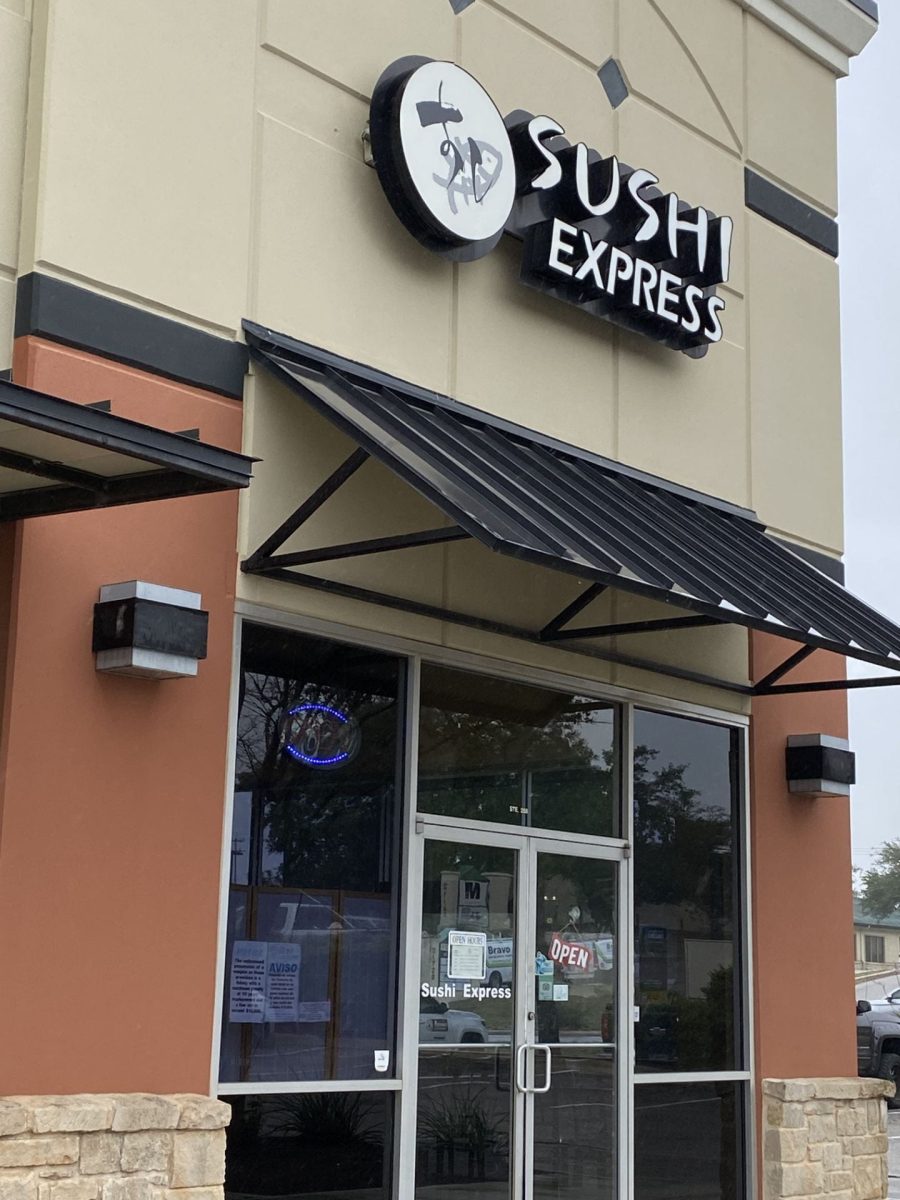 The outside of the Sushi Express restaurant, with an open sign
