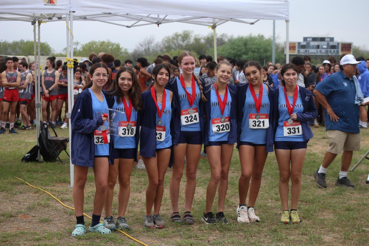 Varsity girls cross country placed second at district competition. photo by Jordan York
