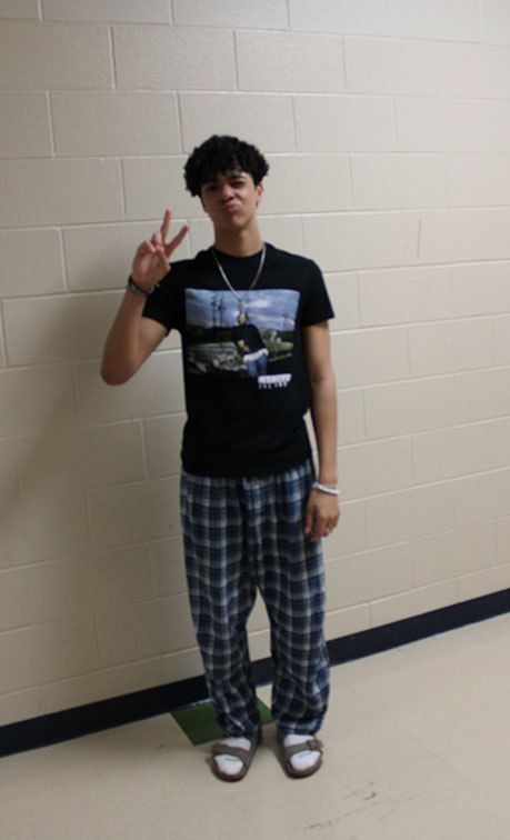 PEACE OUT
Sophomore Silas Fikes wears Pajamas on PJ day. Different themed days filled the stressful week before AP testing begins, and Pajama Day was one of them. Although for Fikes it was unplanned, “honestly I didnt even know it was pajama day, I wear pajamas every day” he said. 
