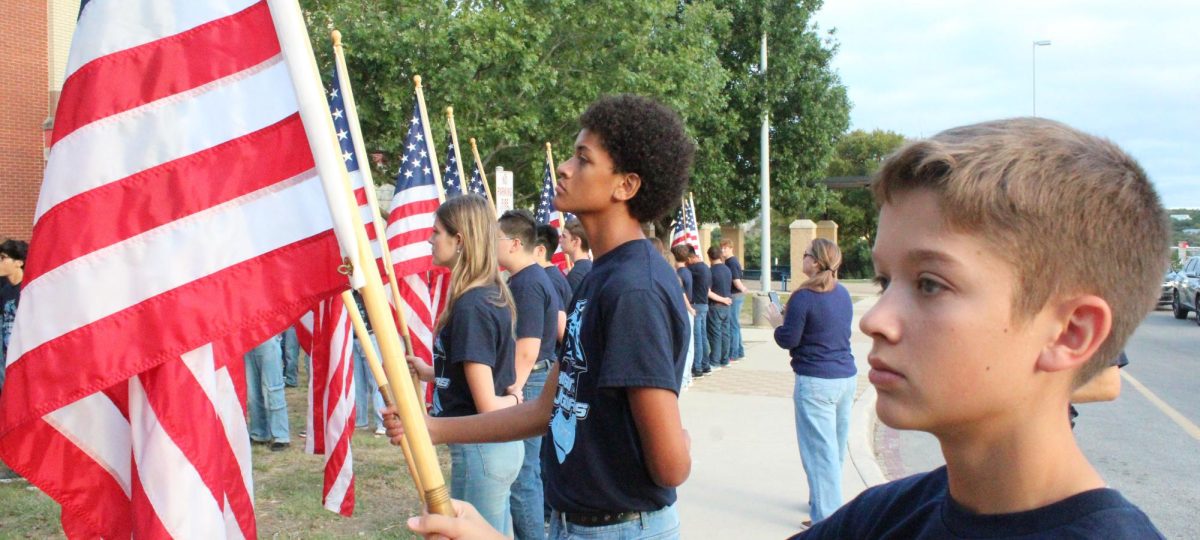 A FLAG TO REMEMBER
JROTC freshman Colin Thompson holds the American flag at the 9/11 ceremony in early september. JROTC cadets honor the losses of 9/11 each September and welcome everyone on campus to join them.
